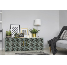 Dekoratives Sideboard mit Pflanzenmuster, Lampe und Bildern in einem Wohnraum