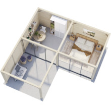 Vue intérieure d''une maison de jardin en bois avec coin chambre, salon et coin repas