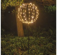 Garten mit einer leuchtenden Kugel aus Lichtern auf einem Stab