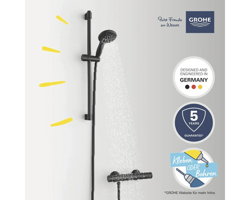 Système de douche avec barre de douche et douchette à main. Logo Grohe. Garantie de cinq ans. Conçu et fabriqué en Allemagne. Coller ou percer.