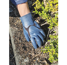Gants de jardinage bleus sur terre de jardin