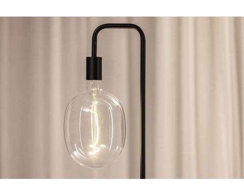 Stehleuchte mit transparentem, birnenförmigem Lampenschirm und schwarzem Gestell
