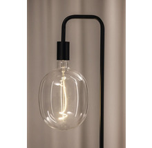 Nahaufnahme einer freiliegenden Glühbirne an einer Stehlampe