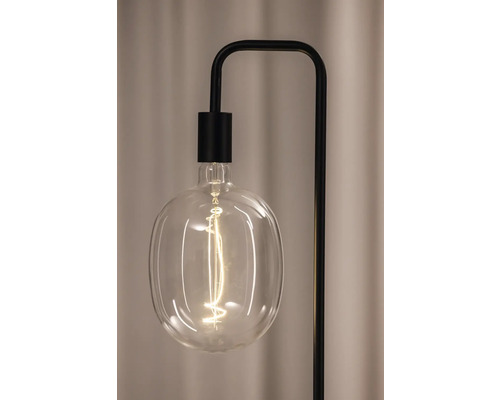 Nahaufnahme einer freiliegenden Glühbirne an einer Stehlampe