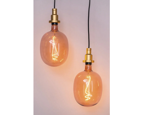 Deux suspensions avec verre ambré et douilles dorées.