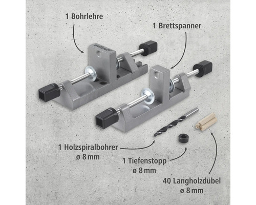 Jeu de chevilles Wolfcraft comprenant un gabarit de perçage, un tendeur de planches, un foret hélicoïdal à bois, une butée de profondeur et des chevilles à bois longues