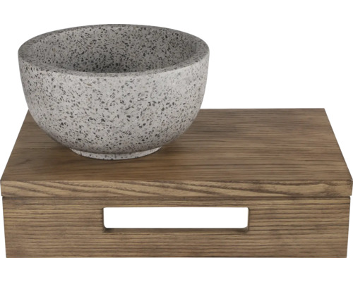 Dekorative Schale aus Stein auf einer Holzbox