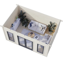 Image intérieure d'un abri de jardin moderne avec canapé, fauteuil et table basse