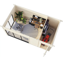 Vue intérieure d'une maison de jardin en bois avec mobilier de bureau, tondeuse à gazon et coin salon