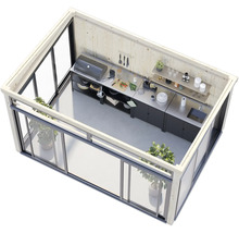 Cuisine extérieure dans une cabane de jardin avec portes coulissantes, barbecue, plan de travail et évier