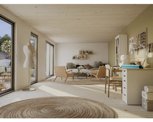 Espace de vie lumineux avec coin salon, mannequin de couture et espace de travail