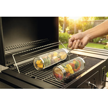 Rouleau à légumes sur un gril avec des aliments grillés