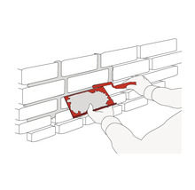 Illustration : les joints d’un mur de briques sont remplis à l’aide d’une truelle à joint