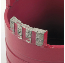 Gros plan d'une scie-cloche avec segments diamantés pour perceuses