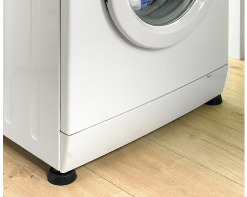 Waschmaschine mit Antivibrationsfüssen auf Holzboden