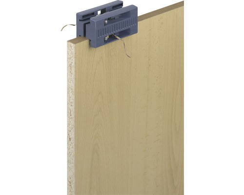 Dispositif de fixation de bordures de chant sur panneau de bois