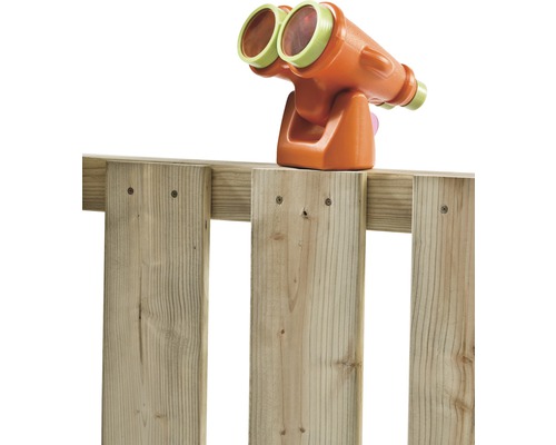 Jumelles jouet montées sur une clôture en bois