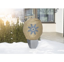 Pot de fleurs avec housse de protection hivernale et motif de flocon de neige dans le jardin
