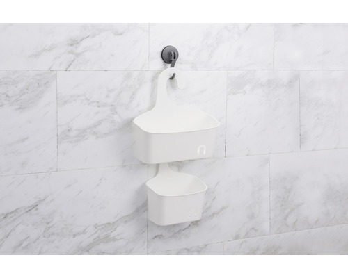 Deux paniers de douche blancs suspendus au mur avec des ventouses