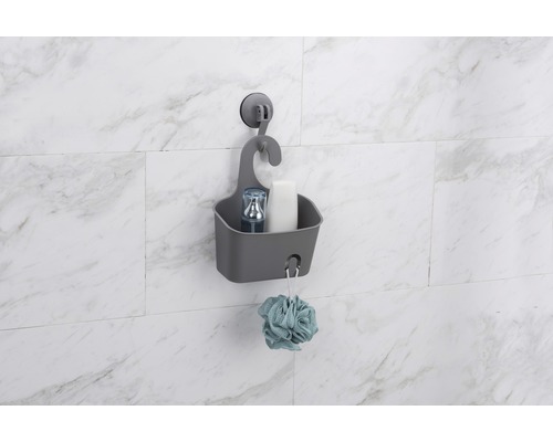 Panier de douche gris avec ventouse pour ranger les accessoires de bain.