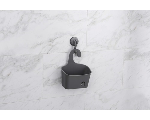 Panier de douche gris avec ventouse pour le rangement dans la salle de bain.