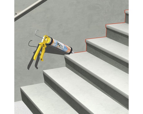 Silikonpistole mit Kartusche auf einer Treppe