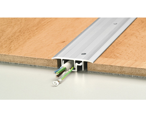 Profilé de transition en aluminium avec chemin de câbles entre deux revêtements de sol