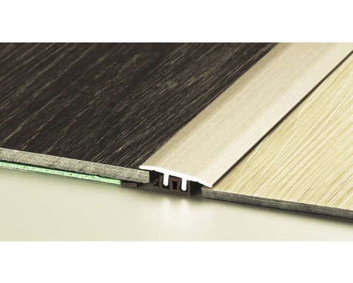 Profilschiene für Bodenbeläge zwischen zwei Bodenbelägen