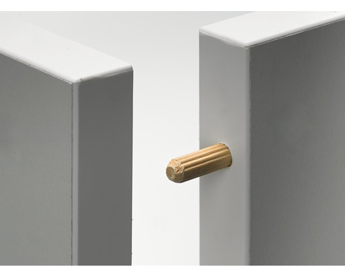 Cheville en bois entre deux pièces blanches