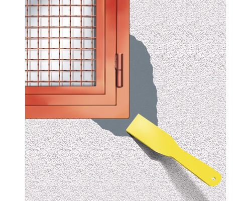 Fenêtre avec grille de protection à côté du couteau à mastic