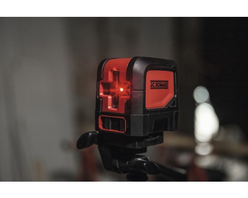 Logo J.C. Schwarz sur un laser lignes croisées avec trépied