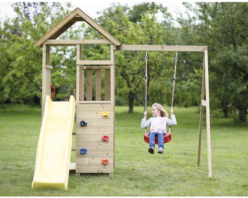 Tour de jeux avec balançoire et toboggan dans le jardin