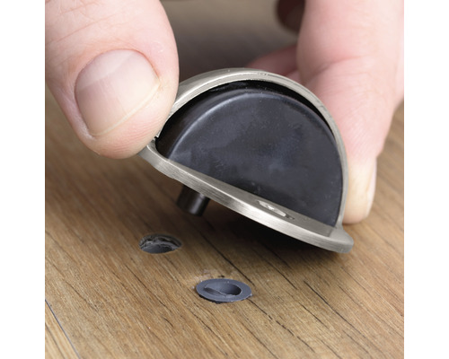 Montage eines Türstoppers auf einem Holzboden