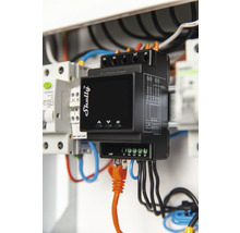 Logo Shelly Compteur d''énergie avec câble LAN orange dans le boîtier à fusibles