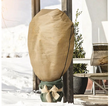 Plante en pot dans un sac de protection hivernale dans la neige
