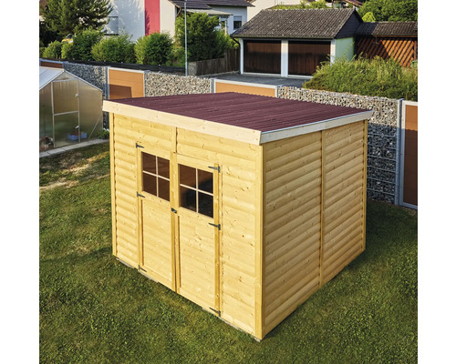 Abri de jardin en bois avec double porte et toit rouge sur pelouse