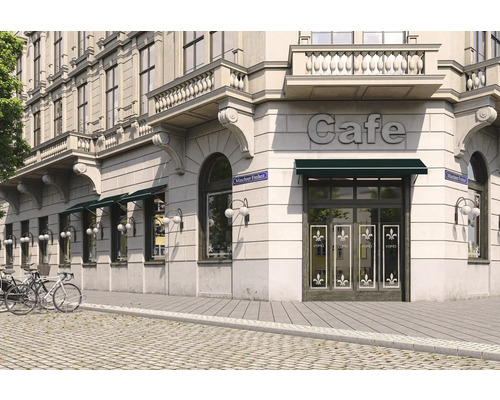 Aussenansicht eines Cafés in einem Stadtgebäude mit Markisen und Fahrrädern