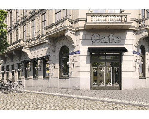 Vue extérieure d''un café dans un immeuble avec façade, avec des vélos devant.