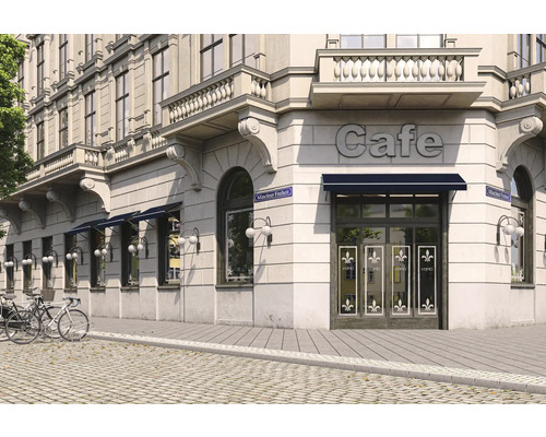 Aussenansicht eines Cafés in einem Eckgebäude mit Markisen und Fahrrädern