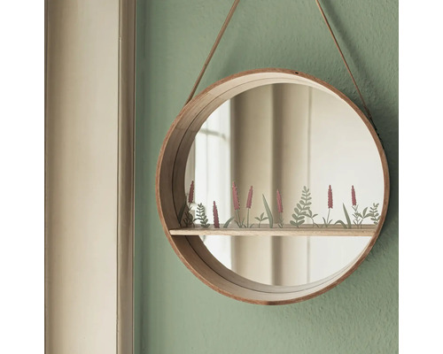 Runder Spiegel mit Holzrahmen und Ablage mit Pflanzenmotiv an der Wand hängend