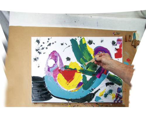 Peinture avec pinceau et éclaboussures de peinture sur toile