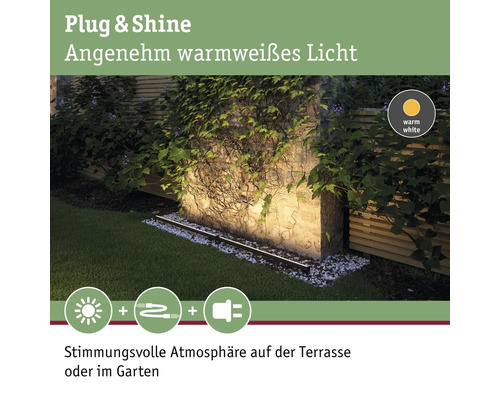 Éclairage de jardin Plug and Shine avec lumière blanche chaude sur un mur