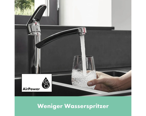 Wasserhahn mit Wasserfluss in ein Glas im Spülbecken und AirPower Symbol