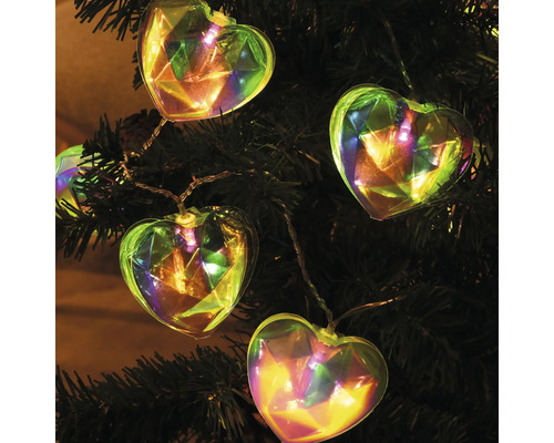 Guirlande lumineuse en forme de cœur sur un arbre