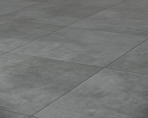 Nahaufnahme von grauen Bodenfliesen mit matter Oberfläche und linearem Fugenmuster