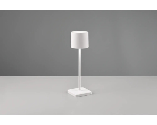 Lampe de table blanche avec abat-jour cylindrique et socle carré.
