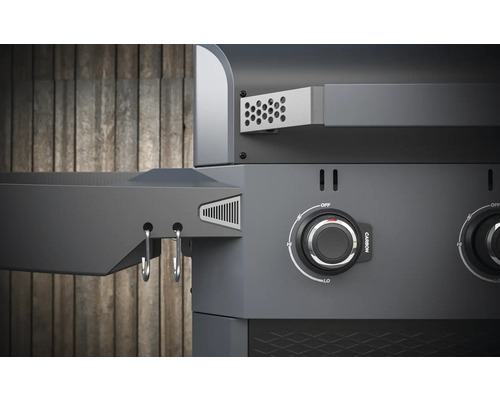 Gros plan d''un barbecue à gaz avec boutons de commande et espace de rangement