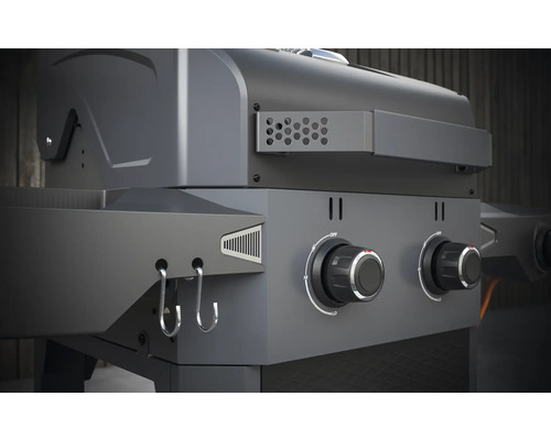 Vue détaillée d''un gril à gaz avec des boutons rotatifs et des crochets