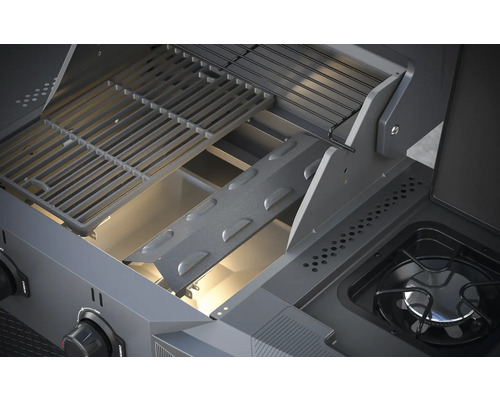 Vue intérieure d''un barbecue avec grille et brûleur