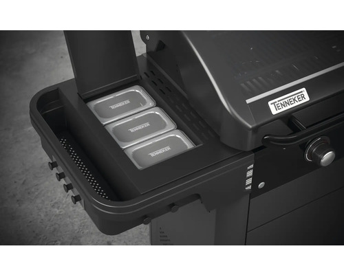 Vue détaillée d''un barbecue à gaz Tenneker noir avec des compartiments de rangement et trois récipients